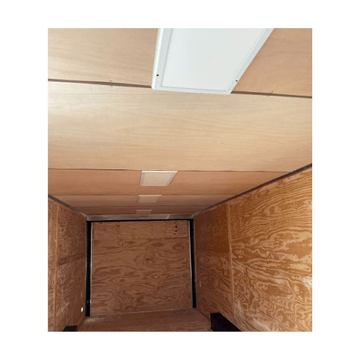 The inside of an enclosed Raw Luan on Ceiling cargo trailer.