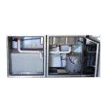 A refrigerator with pipes and hoses in it.