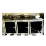 A black and white kitchen with a checkered floor.