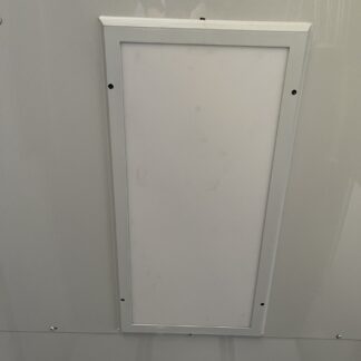 A white panel on the ceiling of a room.