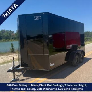 Black 7x14TA enclosed cargo trailer on road, dual-axle with reflective panels and glossy finish, featuring LED taillights and a hitch.
