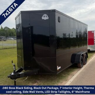 Black enclosed cargo trailer (7x16TA) with dual axles, LED taillights, side vents, and a front hitch, parked on a grassy lot.