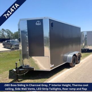 Black enclosed dual‑axle trailer with chrome diamond‑plate trim and a front hitch, parked on a street.