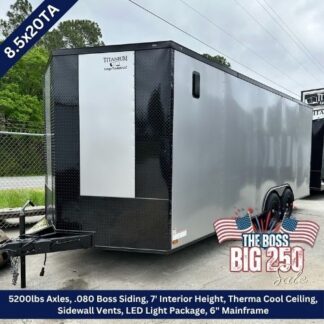 20-foot enclosed tandem-axle cargo trailer for sale; gray with black front, sale banner 'The Boss Big 250' visible, 7' interior height.