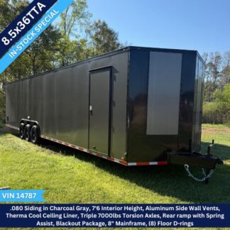 Long black enclosed trailer with tandem axles and a side door, parked on grass; blue overlay shows '8.5x20T in-stock special' and VIN 14787.