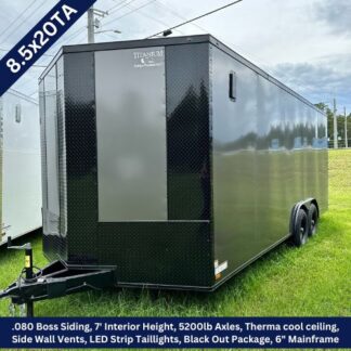 Black enclosed cargo trailer on a grassy lot with dual axles; 8.5x20TA, 7' interior height, ThermaCool ceiling, side wall vents, LED taillights, and blackout package.