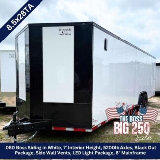 White-and-black cargo trailer on a sales lot, 8.5x28, with LED lighting and black-out package; features include 7' interior height and 5200 lb axles, advertised for 'The Boss Big 250 Sale'