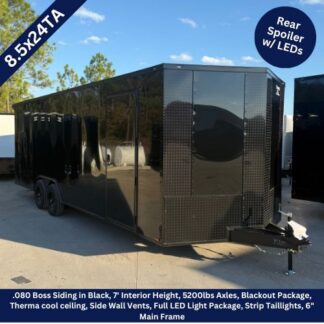Black 8.5x24-foot enclosed cargo trailer with dual axles, diamond-plate front, and a hitch, shown outdoors. Teaser banners indicate rear spoiler with LEDs and a 8.5X24TA model size.