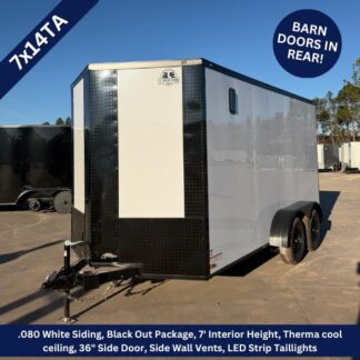 Enclosed dual-axle cargo trailer with white siding and black front, barn doors in rear, parked on lot.