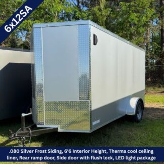 Silver enclosed cargo trailer with diamond-plate front, single axle, hitch, rear ramp door and side entry door; LED lighting and interior height noted (6'6").
